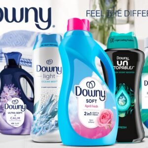 Promotional graphic featuring assorted Downy laundry care products including scent booster beads, dryer sheets, and fabric care items.