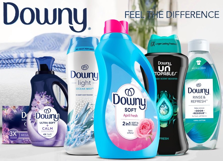 Promotional graphic featuring assorted Downy laundry care products including scent booster beads, dryer sheets, and fabric care items.
