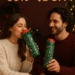 Two people enjoying ENCOOL Christmas-themed insulated water bottles with festive holiday designs