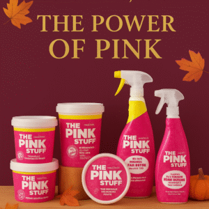 Stardrops The Pink Stuff cleaning collection displayed on a wooden counter with pink labels and gold fall accents