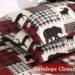 Holiday-themed wildlife duvet set displayed on a bed with reindeer and plaid accents, styled in a cozy winter bedroom.