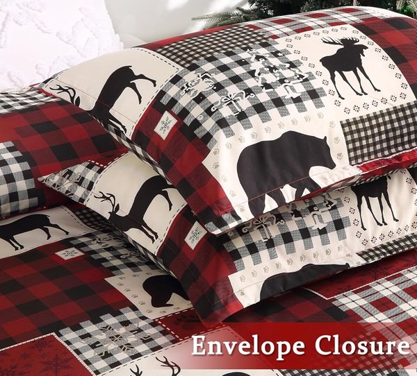 Holiday-themed wildlife duvet set displayed on a bed with reindeer and plaid accents, styled in a cozy winter bedroom.