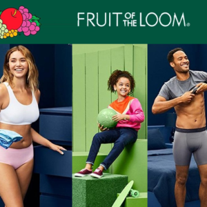 Fall lifestyle scene with a person layering soft cotton apparel in cozy indoor lighting