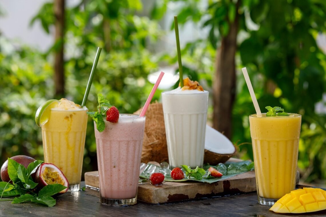 Protein smoothies in glasses with nutritional supplement theme