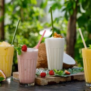 Protein smoothies in glasses with nutritional supplement theme
