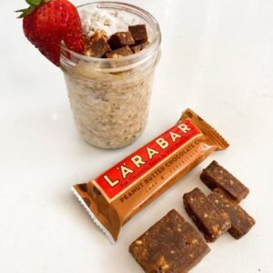 Larabar peanut butter chocolate bar with shake representing snack options