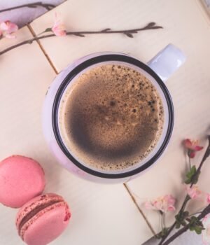 A warm, inviting image featuring coffee, creamers, and pantry items styled in a cozy kitchen setting
