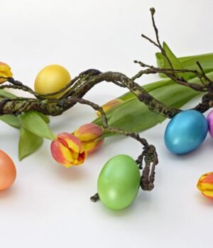 A bright spring-themed promotional image featuring Easter candy, toys, and basket fillers with soft seasonal colors and festive elements designed to highlight savings and mix-and-match deals.