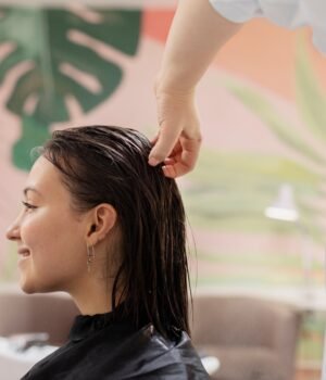 Featured image shows smooth, styled hair with soft lighting, representing healthy shine and professional hair care results