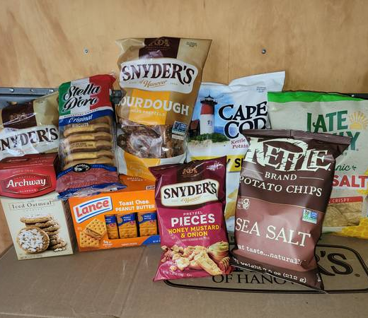 Chips, pretzels, crackers, and snack foods arranged for family game night gatherings and pantry stock-ups