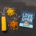 Love Corn crunchy snack products featured in a Daily Deal Busters grocery savings promotion.
