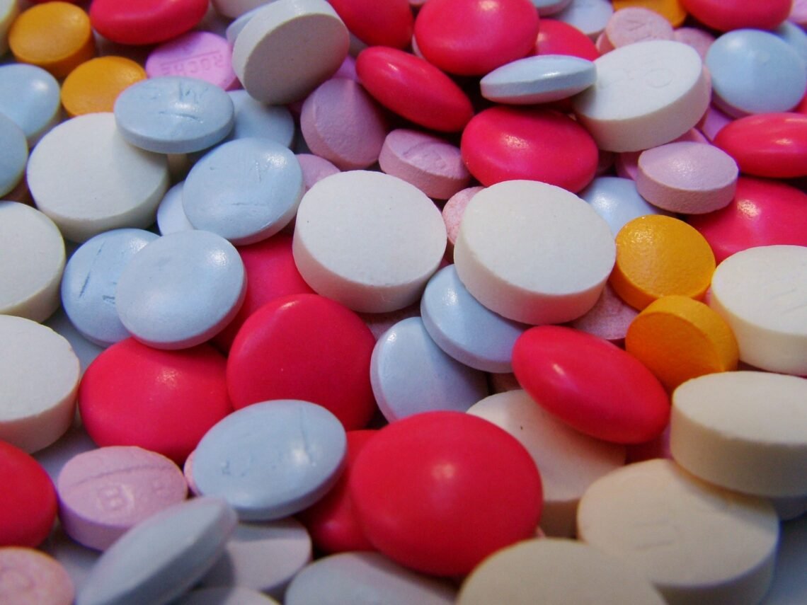 Vitamins, probiotics, supplements, and wellness essentials arranged for practical household stock-ups