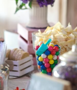 A buffet table filled with snacks and treats arranged for family gatherings with soft natural lighting and a warm entertaining atmosphere