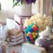A buffet table filled with snacks and treats arranged for family gatherings with soft natural lighting and a warm entertaining atmosphere