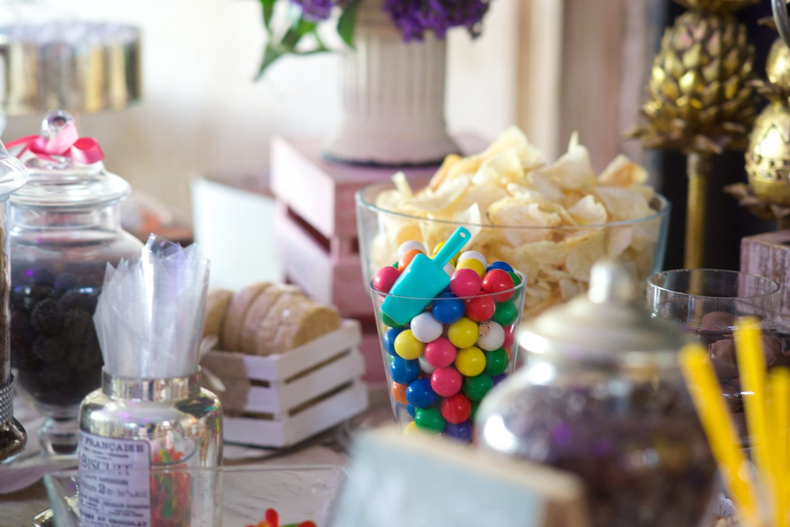 A buffet table filled with snacks and treats arranged for family gatherings with soft natural lighting and a warm entertaining atmosphere