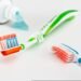 A bright and clean dental care scene with toothbrushes and toothpaste, styled with a soft spring aesthetic and fresh, minimal tones
