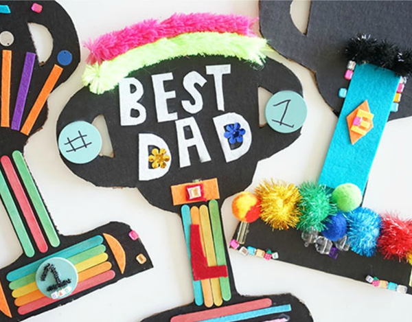 Father's Day gift products including electronics, grilling accessories, apparel, books, and gadgets featured in a promotional sale graphic.