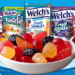 Promotional graphic featuring assorted Welch's Fruit Snacks in a variety of flavors and package sizes.