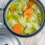 Homemade cabbage and sausage stew with fresh vegetables.