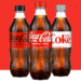 Coca-Cola bottled soda products featuring classic cola branding and assorted beverage varieties.