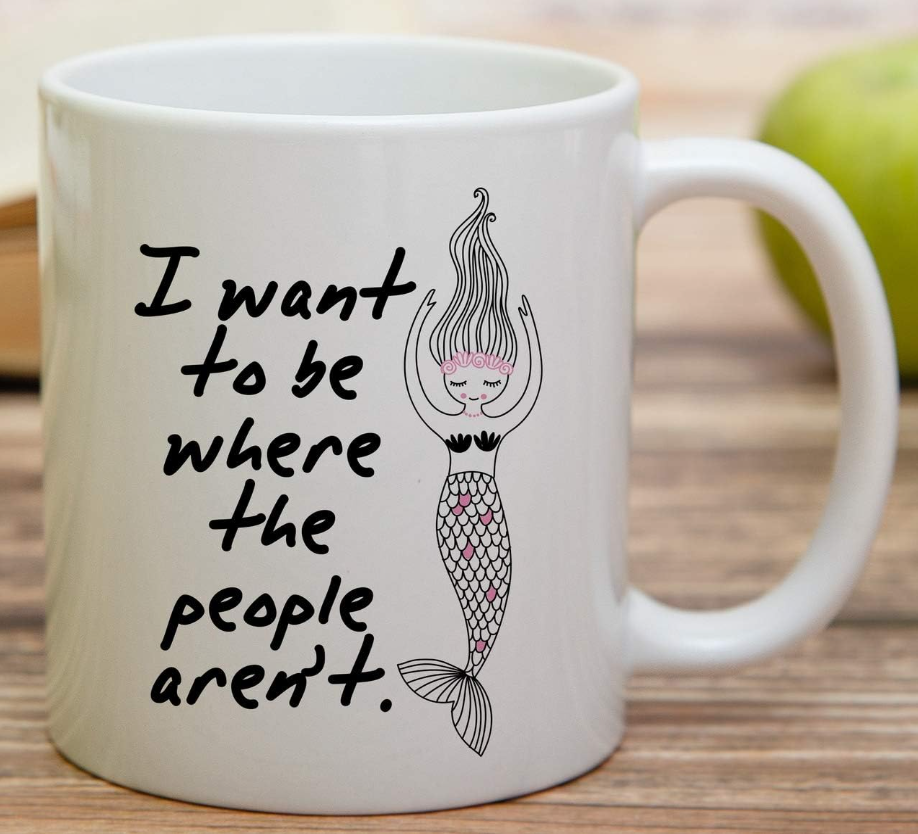 Funny white ceramic coffee mug featuring the phrase “I Want to Be Where the People Aren’t.”