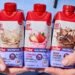 SlimFast ready-to-drink protein and meal replacement shakes in chocolate, strawberry, caramel macchiato, and vanilla varieties.