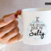 The Ocean Made Me Salty mermaid-themed 11-ounce white ceramic coffee mug.