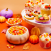 Brach's candy corn packages displayed together with pieces of classic candy corn.